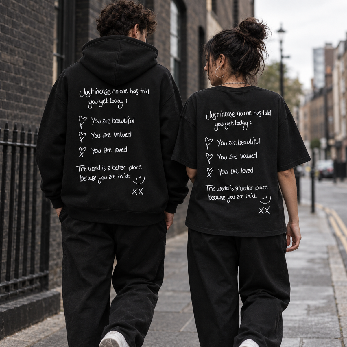 Urban model photo of the Just In Case hoodie and tee back designs