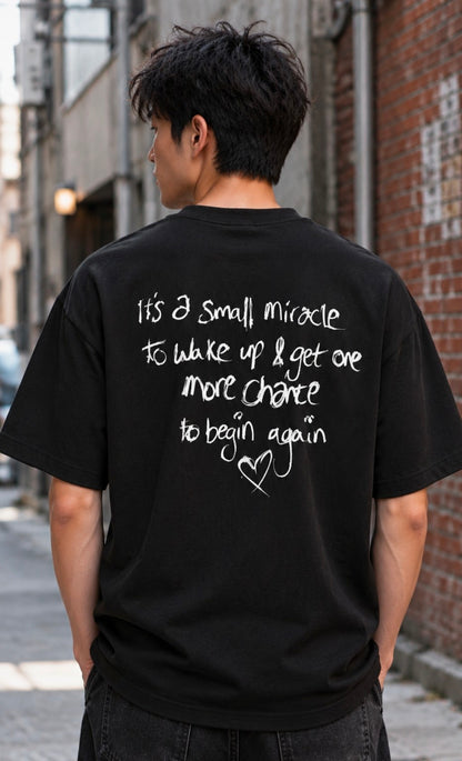 Back view of black One More Chance Tee with large white print