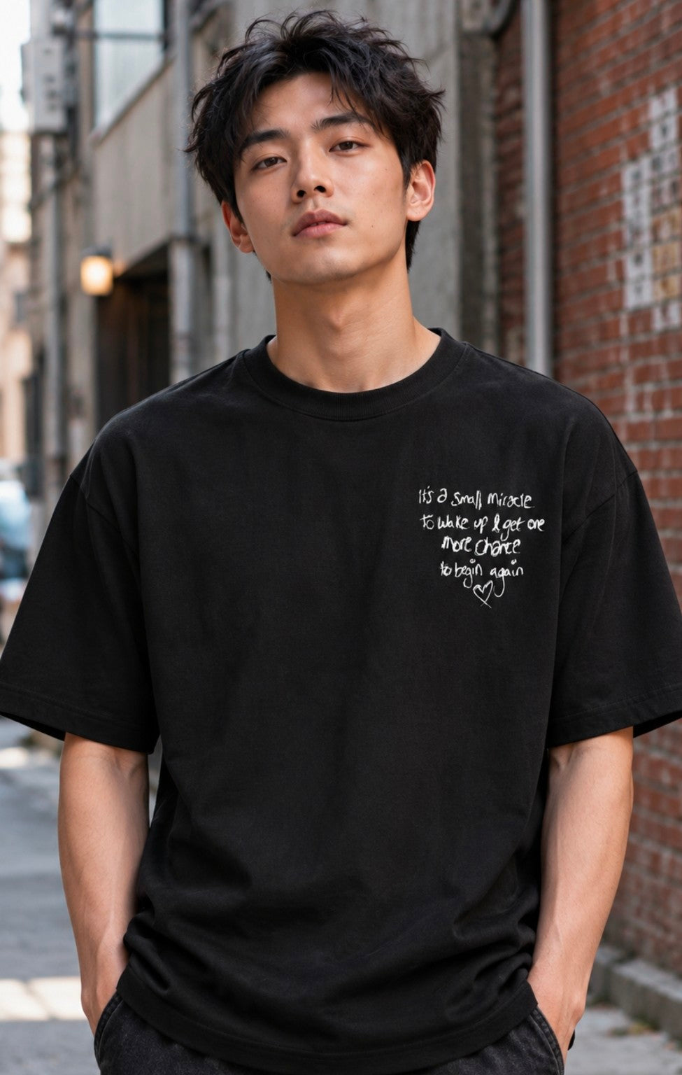 Front view of black One More Chance Tee with small white chest print