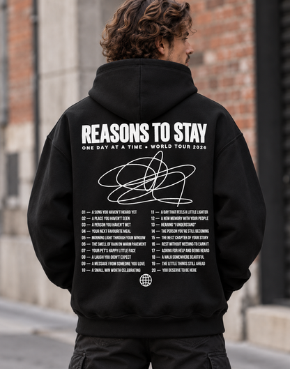 Original ultra-heavy black hoodie, back view with white Reasons to Stay World Tour 2026 print and 20 reasons list