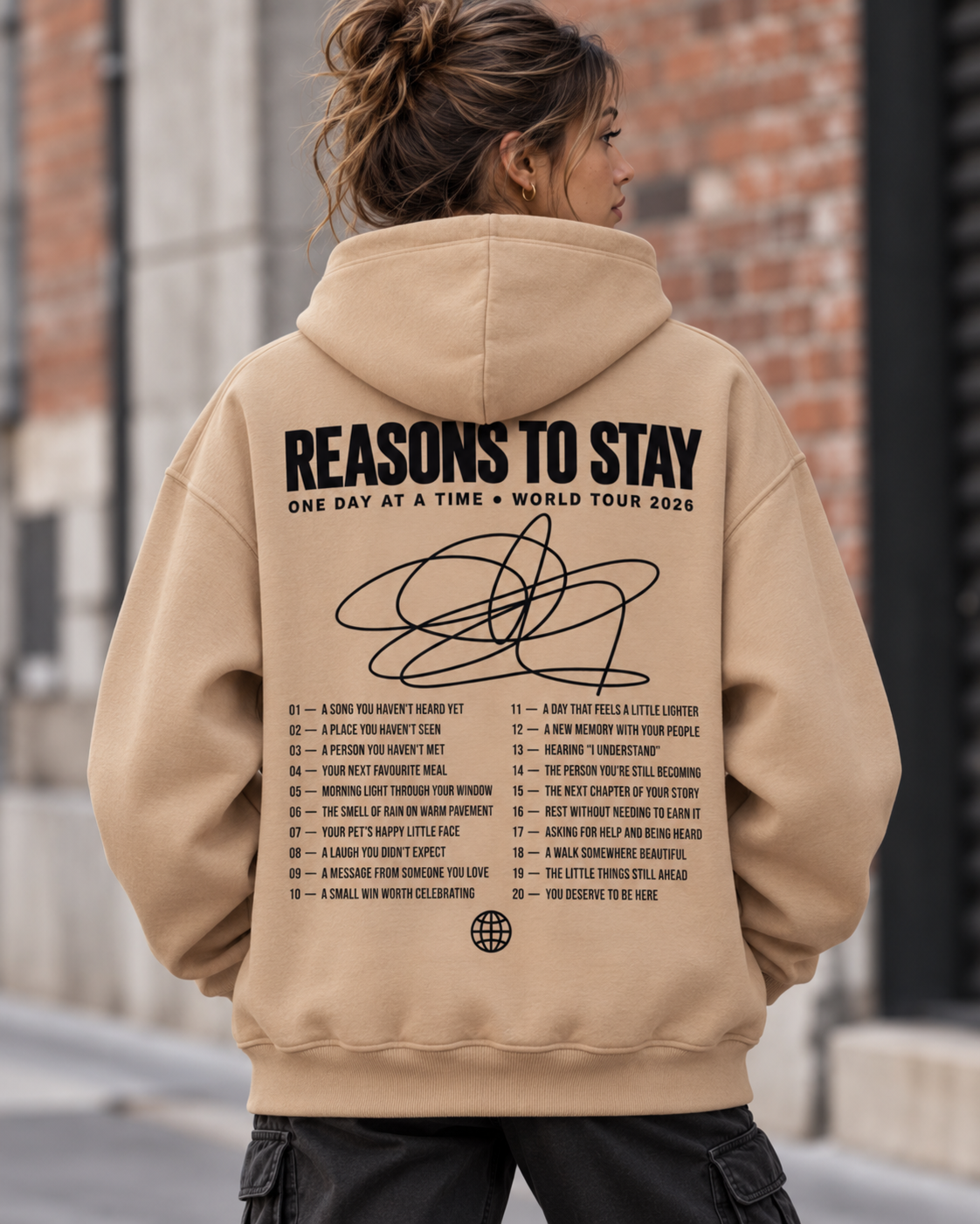 Back view of the sand Ultra-Heavy hoodie with black Reasons to Stay print